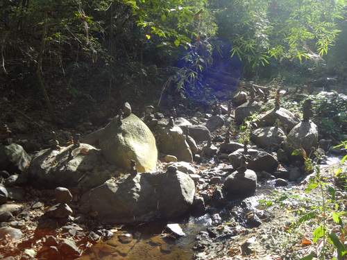stone towers behind waterfall